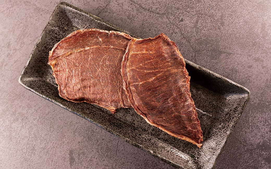 Air Dried Camel Jerky pieces served out of the pouch, no artificial additives, preservatives, coloring. A natural camel dog treats treat for dogs and cats from Michinoku Farm Singapore