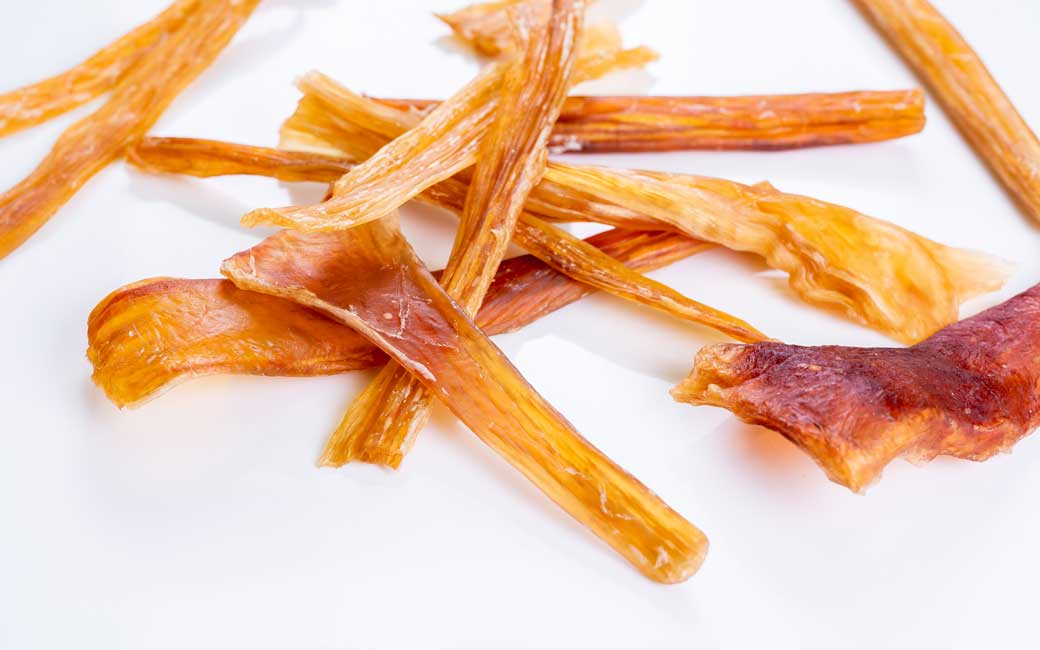 Close-up of Air Dried Horse Achilles showing the natural texture of this freeze dried horse. Promotes dental health while chewing, a healthy air-dried treat from Michinoku Farm Japan