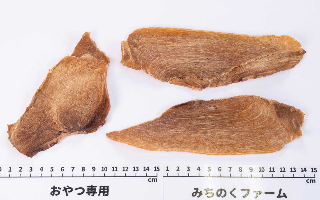 Close-up of Air Dried Iwami Pork Jerky showing the natural texture of this freeze dried pork for dogs. Lean cuts, protein-rich treat, a healthy air-dried treat from Michinoku Farm Japan