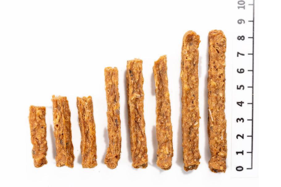 Close-up of Air Dried Minced Salmon Stick showing the natural texture of this salmon dog treats. Rich in Omega-3 DHA and EPA, a healthy air-dried treat from Michinoku Farm Japan
