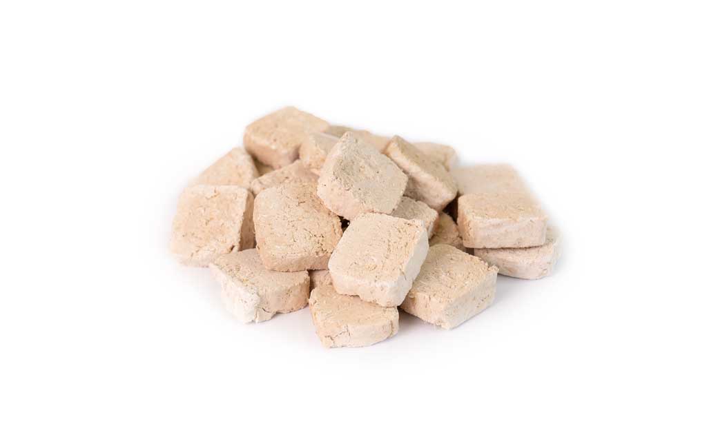Close-up of Freeze Dried Chicken Meat Cookie showing the light, crispy texture of this gluten-free chicken dog treats. High protein, easy to break, a healthy treat from Michinoku Farm Japan